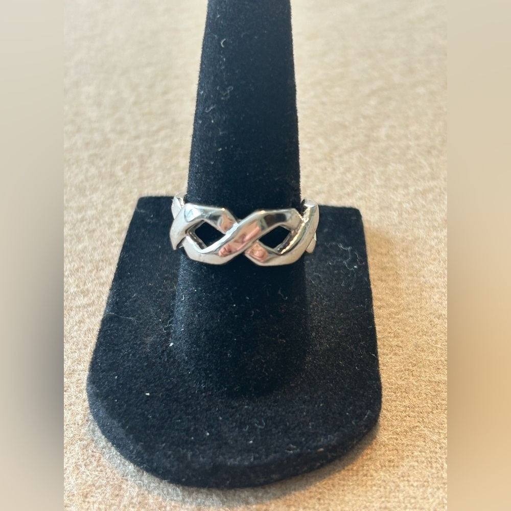 Bold Silver Toned Infinity Ring Size 7. Excellent condition.​